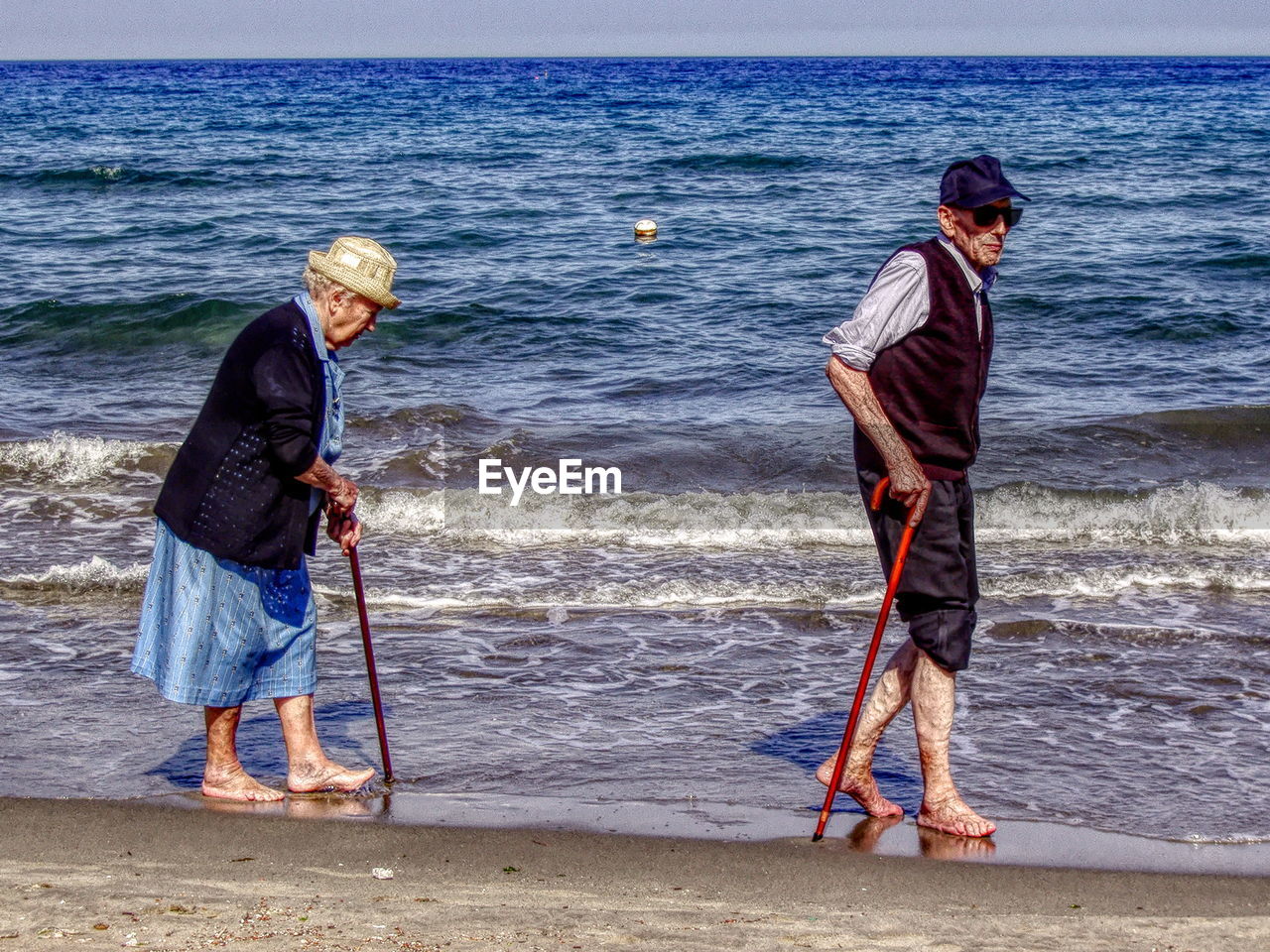 FRIENDS STANDING ON BEACH