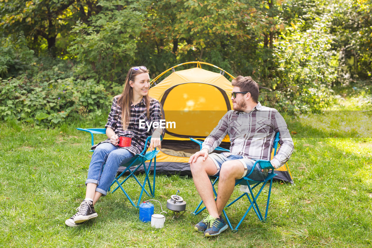 Young couple sitting in park