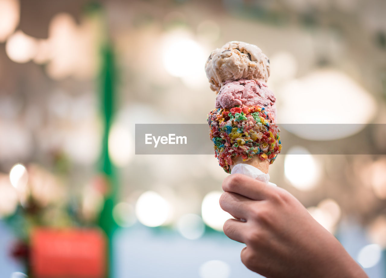 Cropped image of hand holding ice cream