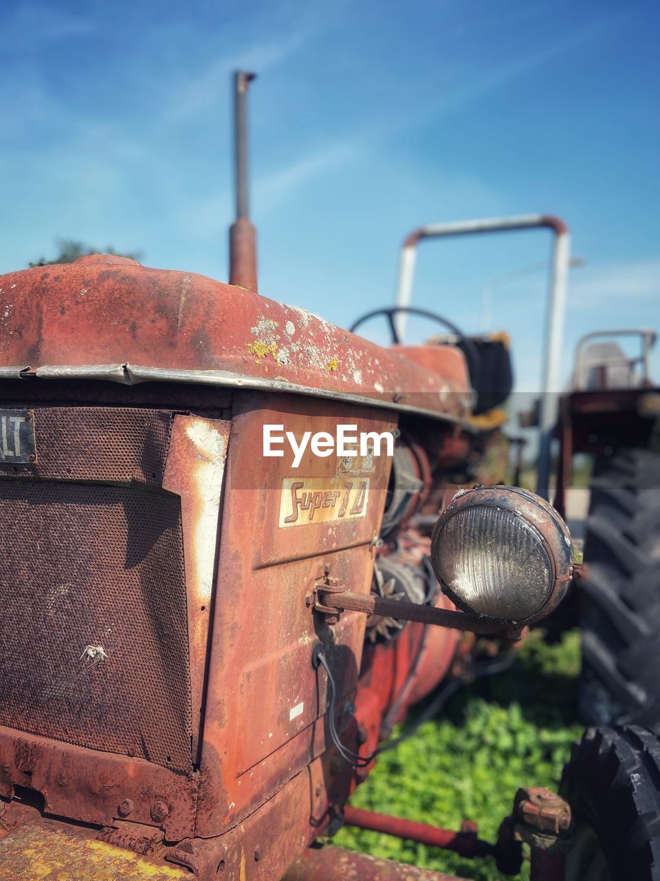 CLOSE-UP OF RUSTY MACHINE PART