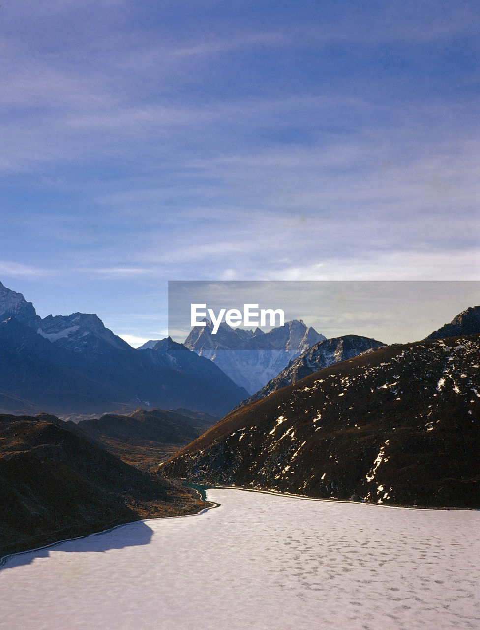 Scenic view of mountains against sky during winter