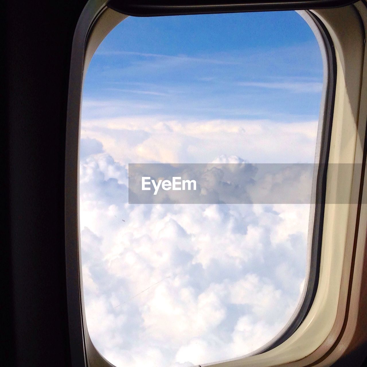 Clouds seeing through airplane window