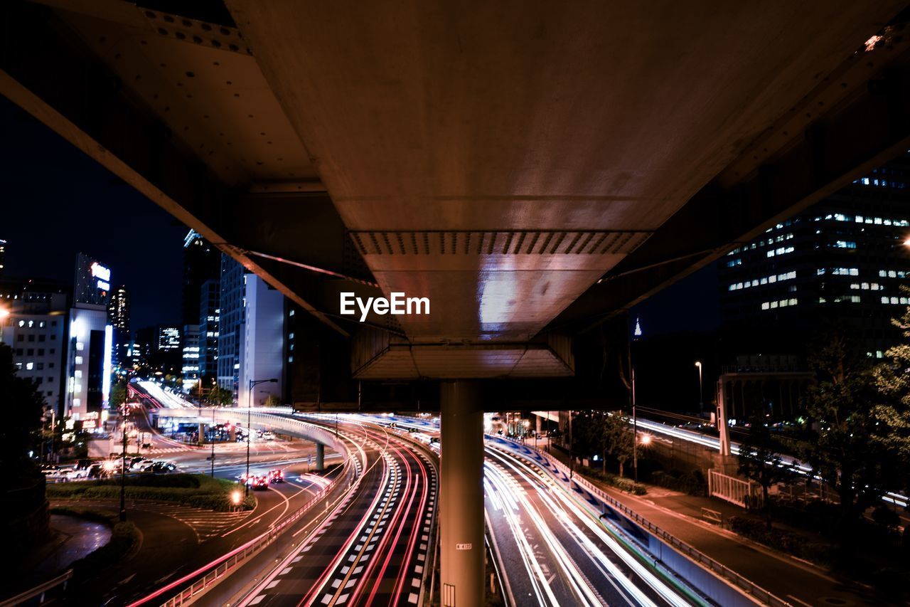 Light trails on road in city at night