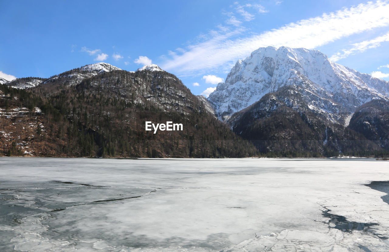 Scenic view of snowcapped mountains against sky