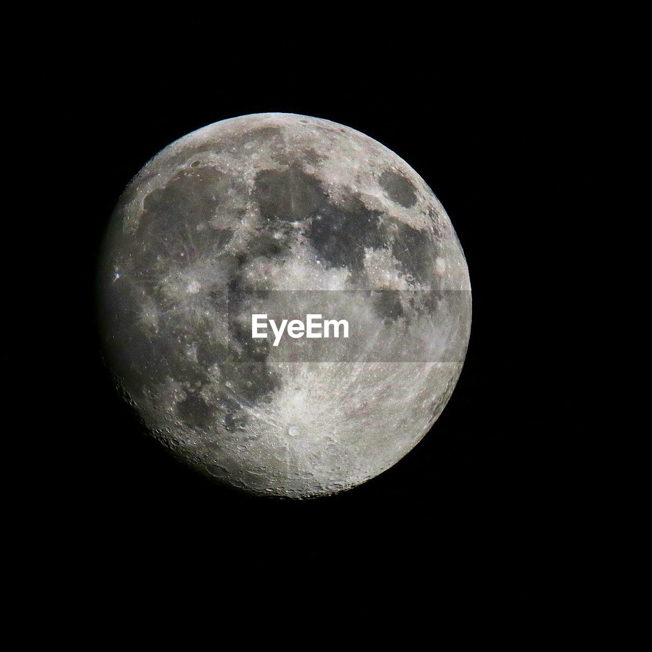 LOW ANGLE VIEW OF MOON AGAINST CLEAR SKY