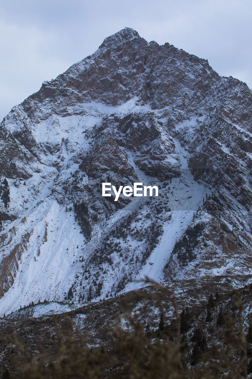 Scenic view of snowcapped mountain against sky