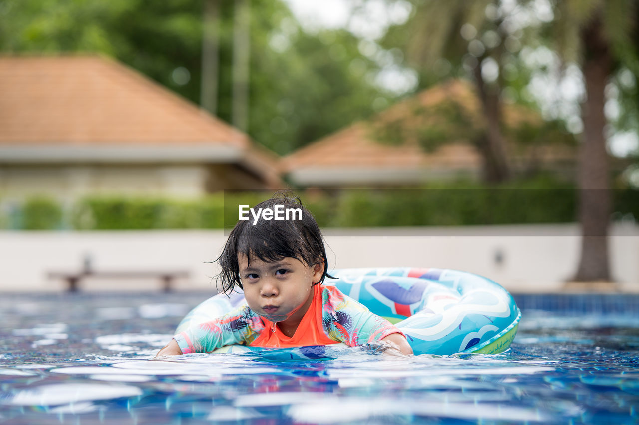 Portrait of boy in swimming pool