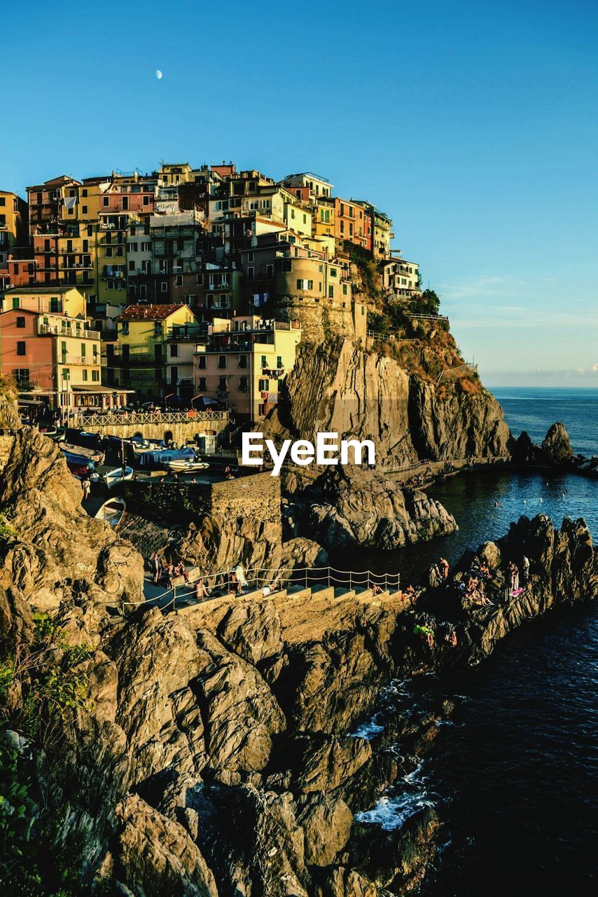 Panoramic view of sea against clear blue sky