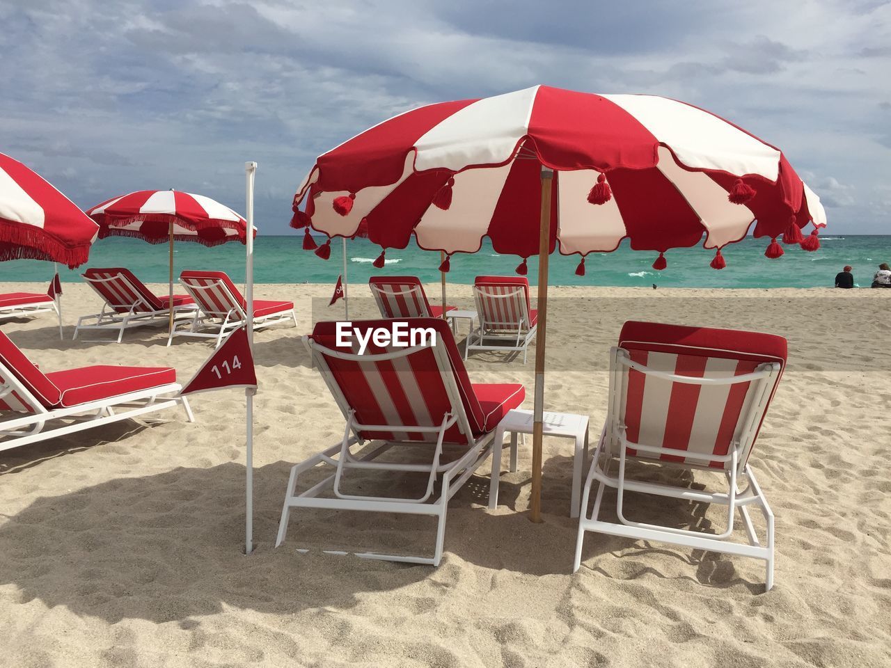 View of beach against cloudy sky