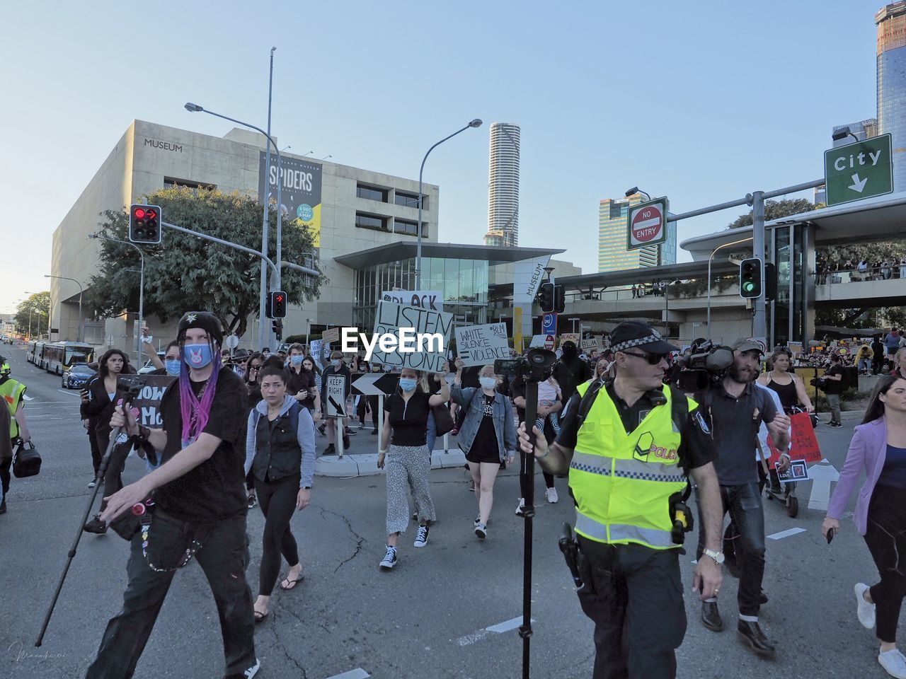 GROUP OF PEOPLE ON CITY STREET