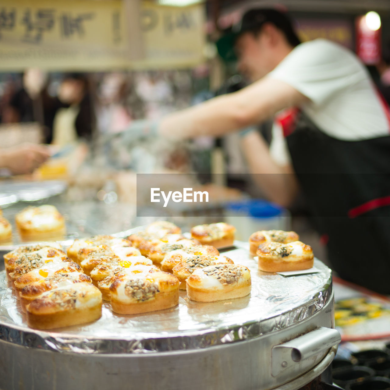 Man preparing food on street