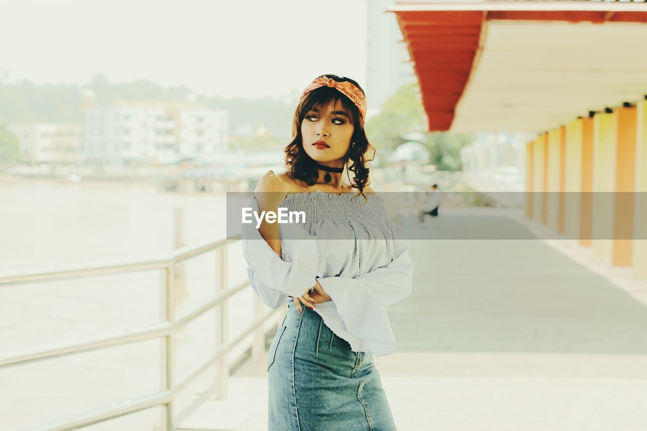 Young woman standing on walkway