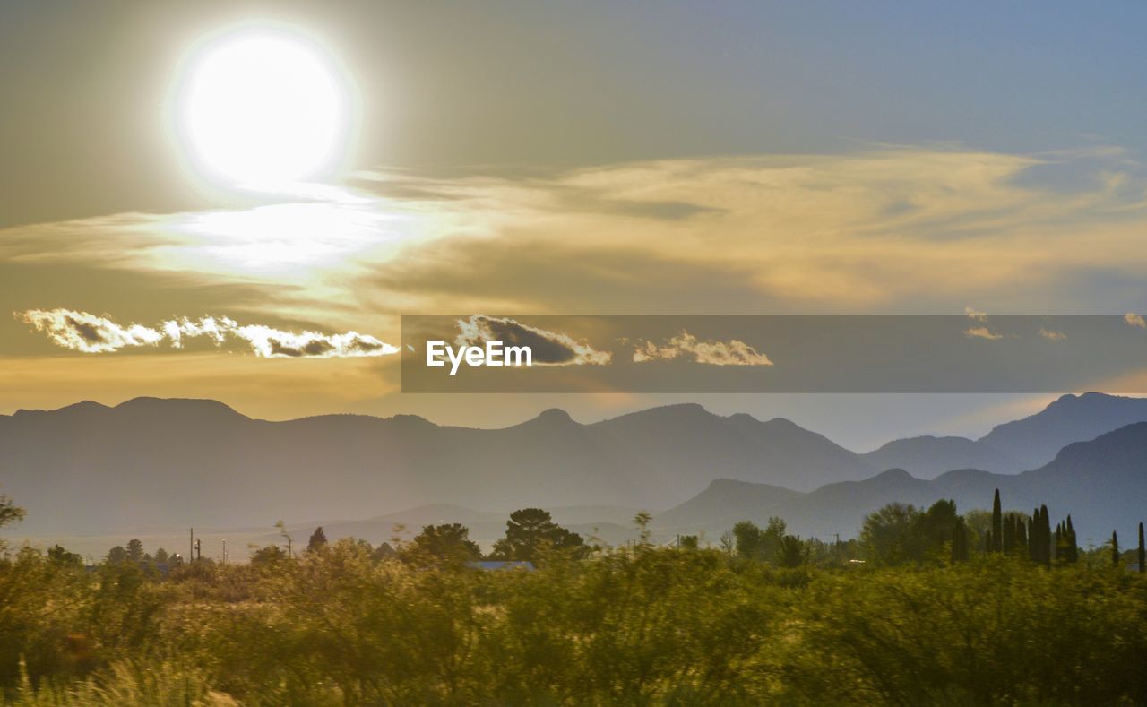 Scenic view of mountains against sky during sunset