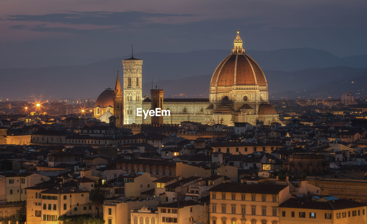 High angle view of illuminated buildings in city against sky florence 