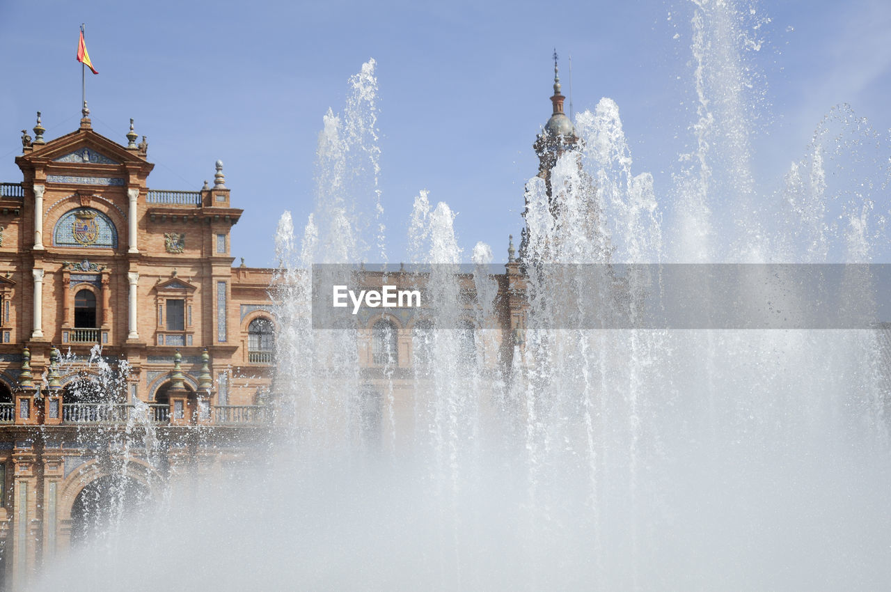 Fountain outside plaza de espana against clear sky