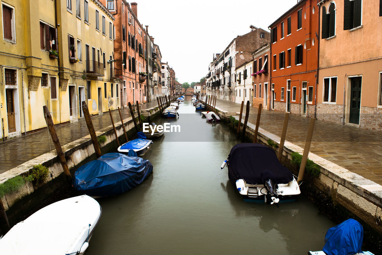 Canal amidst buildings in city