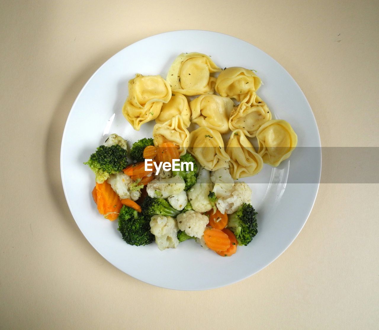 High angle view of dumplings with salad in plate
