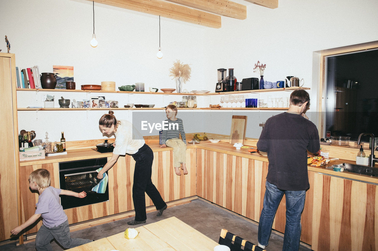 Family having fun while preparing food in kitchen at home