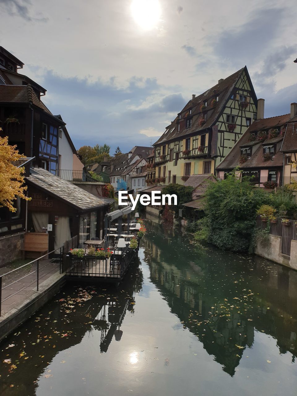 CANAL AMIDST BUILDINGS IN CITY