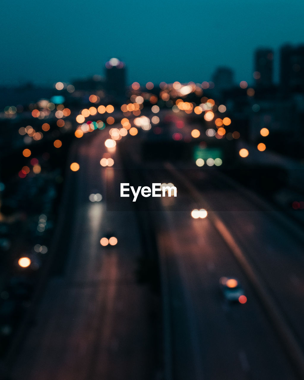 Defocused image of illuminated street lights at night