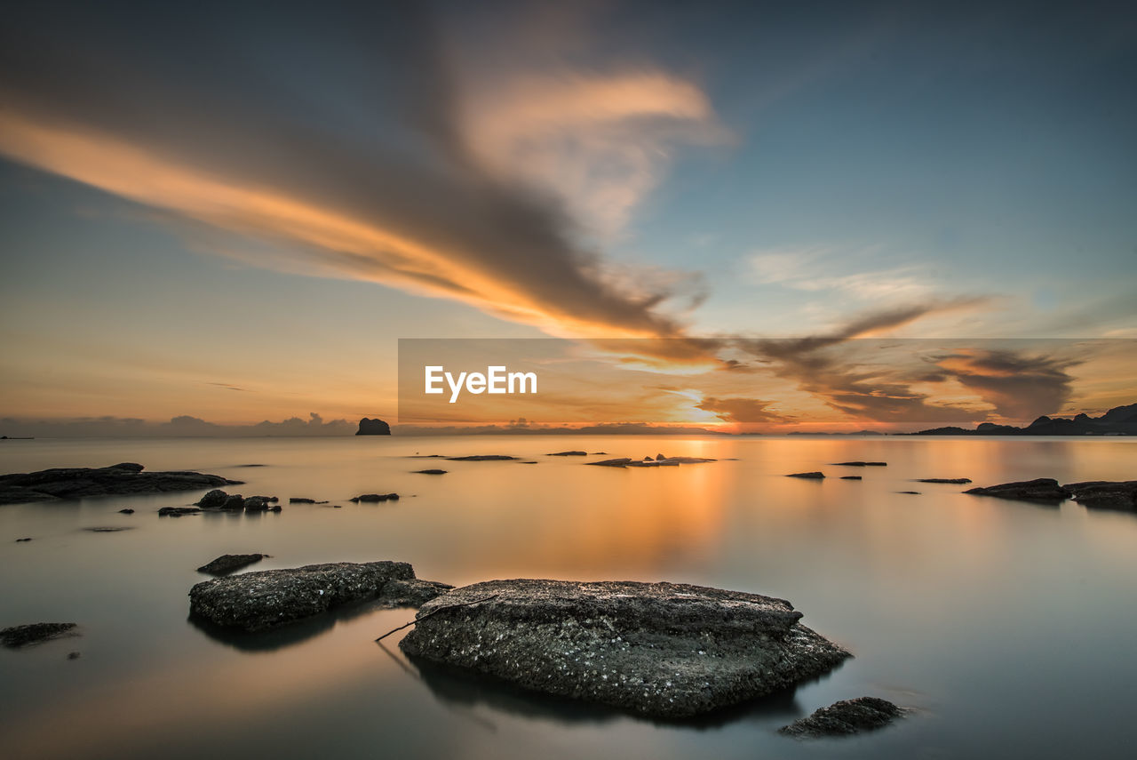 Scenic view of sea against sky during sunset
