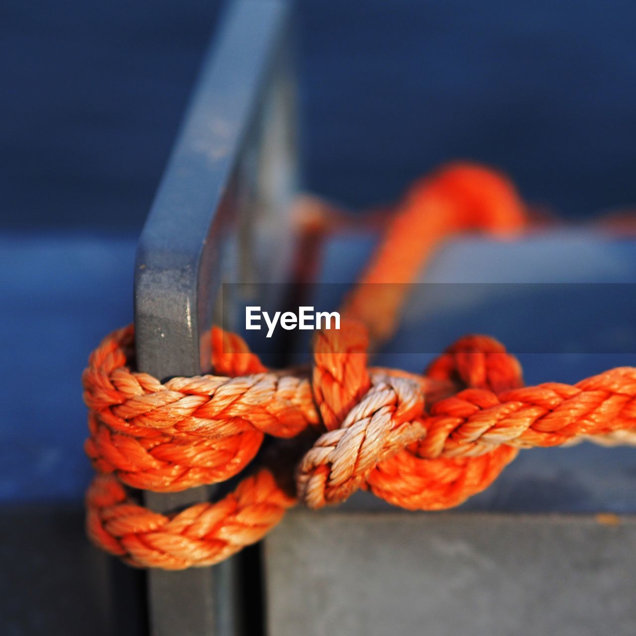 Close-up of rope tied on metal