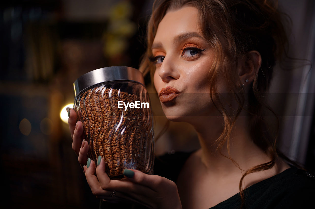 Girl with a can of buckwheat