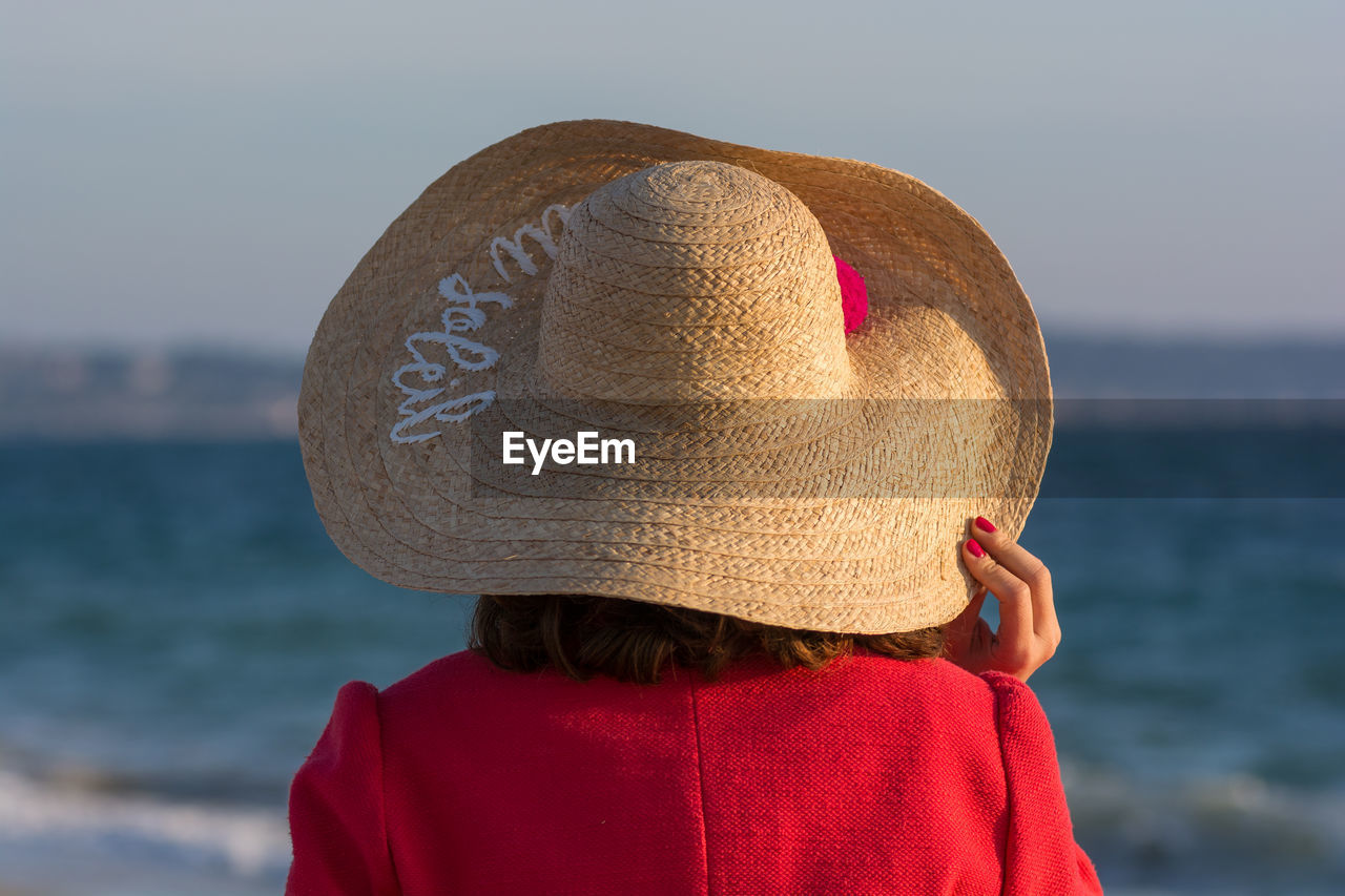 Rear view of woman wearing sun hat