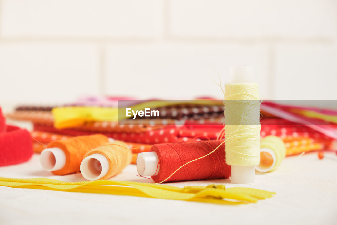 CLOSE-UP OF MULTI COLORED PENCILS IN CONTAINER