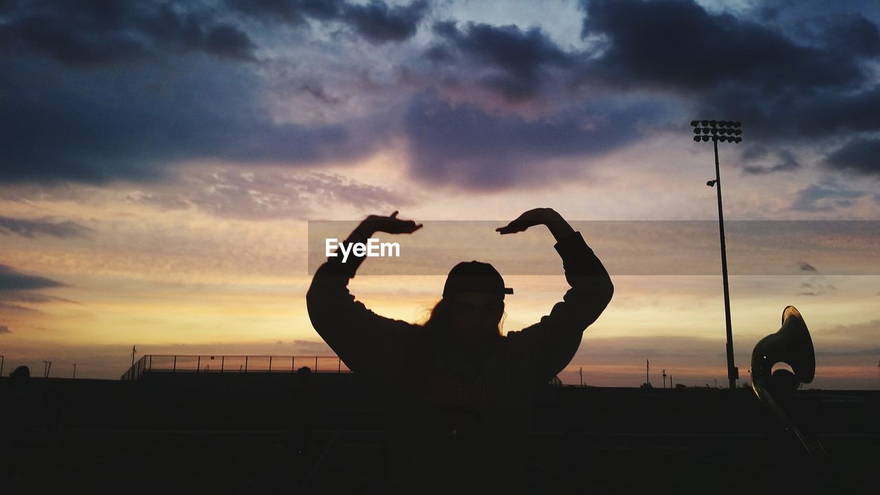 SILHOUETTE MAN AGAINST SKY