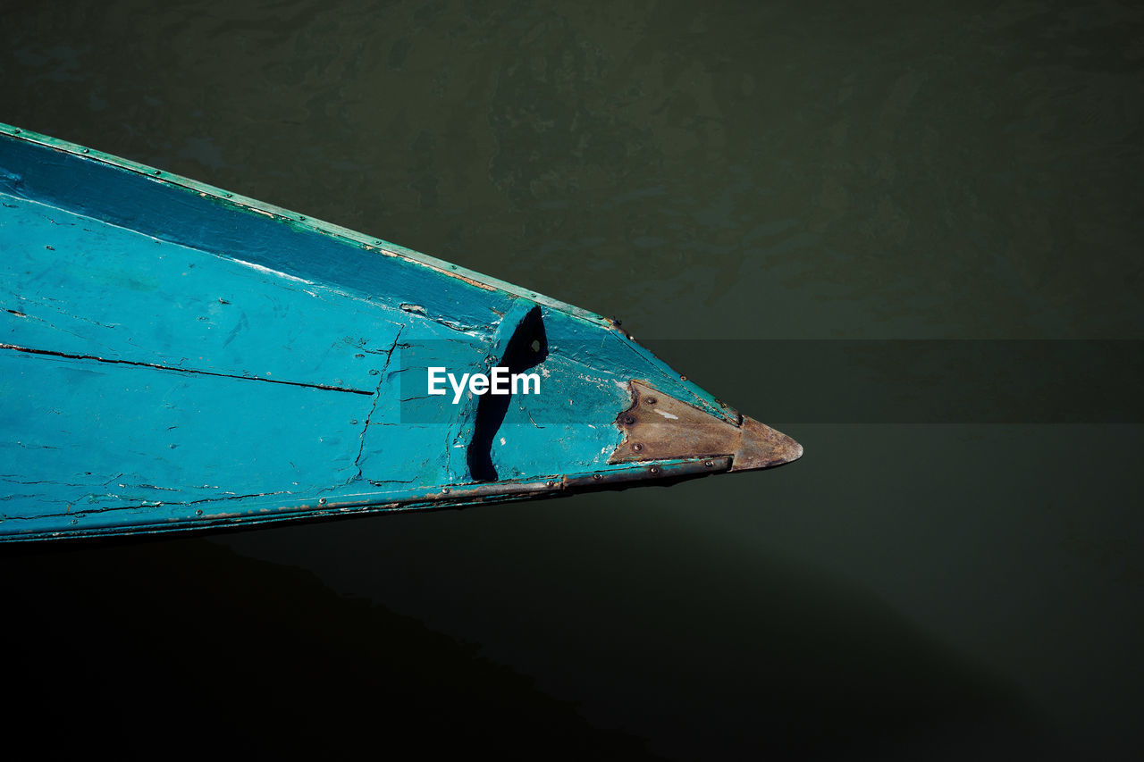 water, blue, nautical vessel, no people, mode of transportation, day, nature, transportation, reflection, close-up, sunlight, high angle view, outdoors, waterfront, moored, lake, wood - material, metal, shadow, turquoise colored