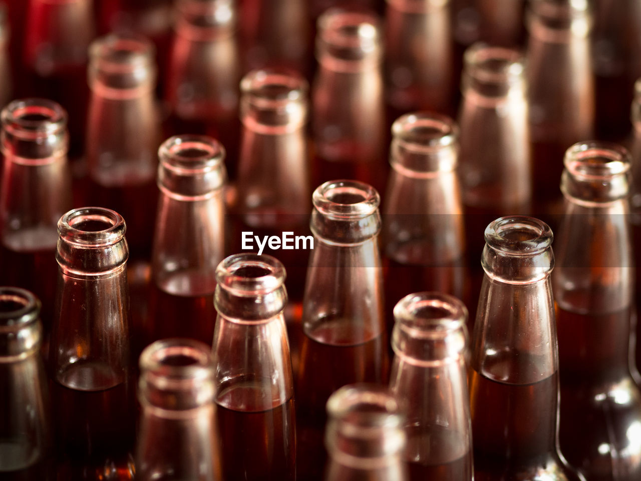 Close-up of glass bottles full of oil at temple