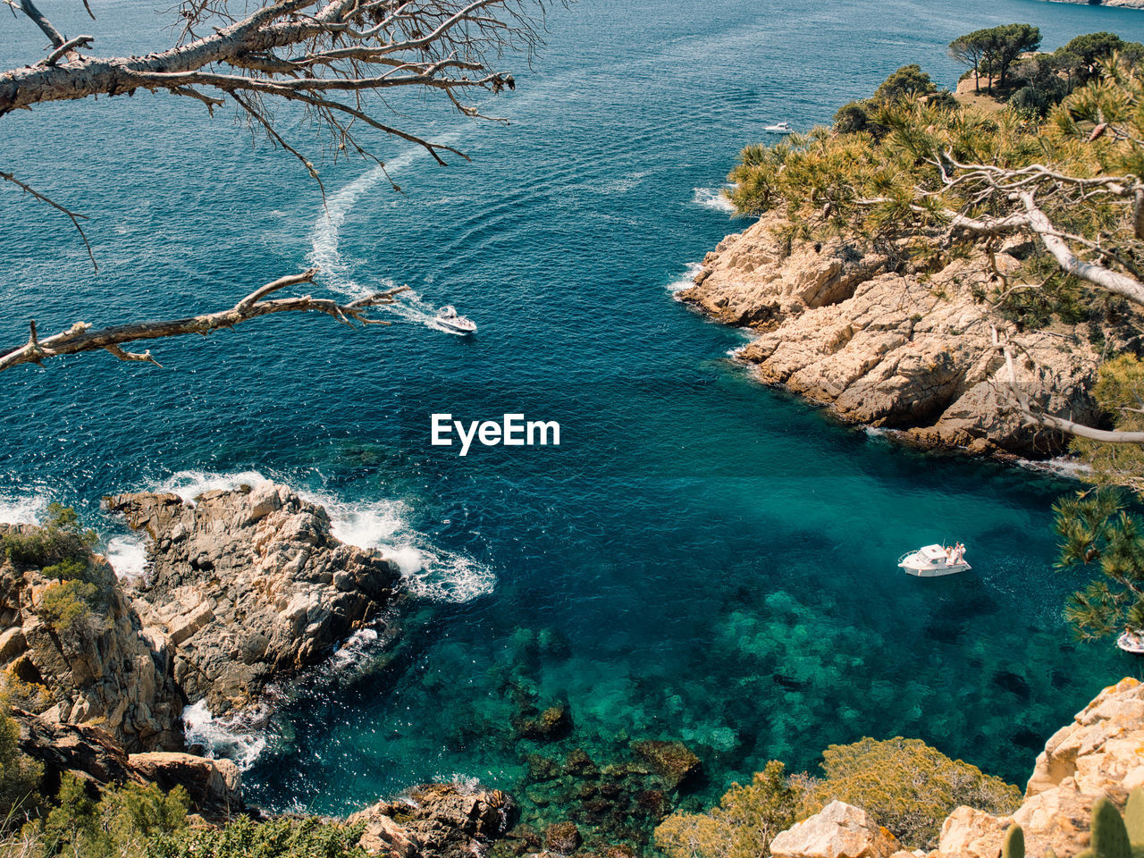 High angle view of rocks on sea