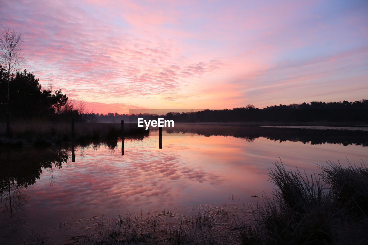 SCENIC VIEW OF LAKE DURING SUNSET