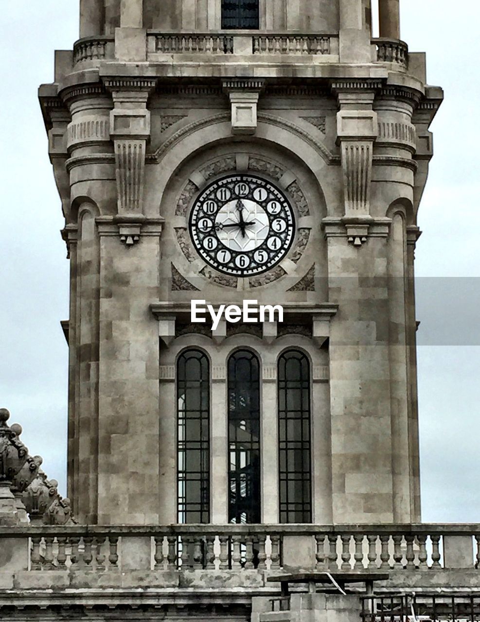 Low angle view of historic clock tower against sky