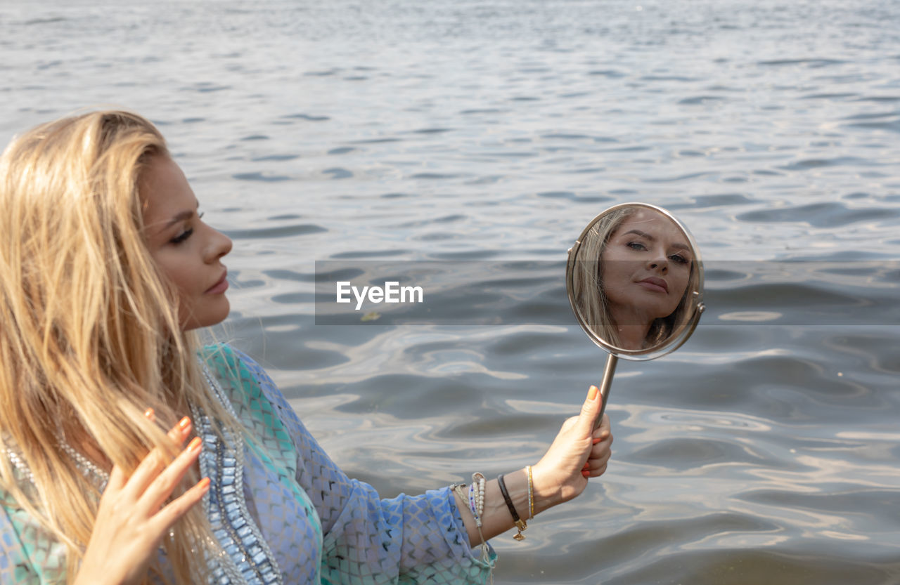 Portrait of smiling woman in water