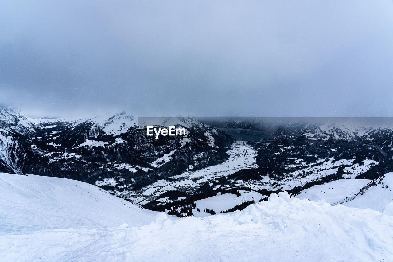 Snow covered mountain against sky