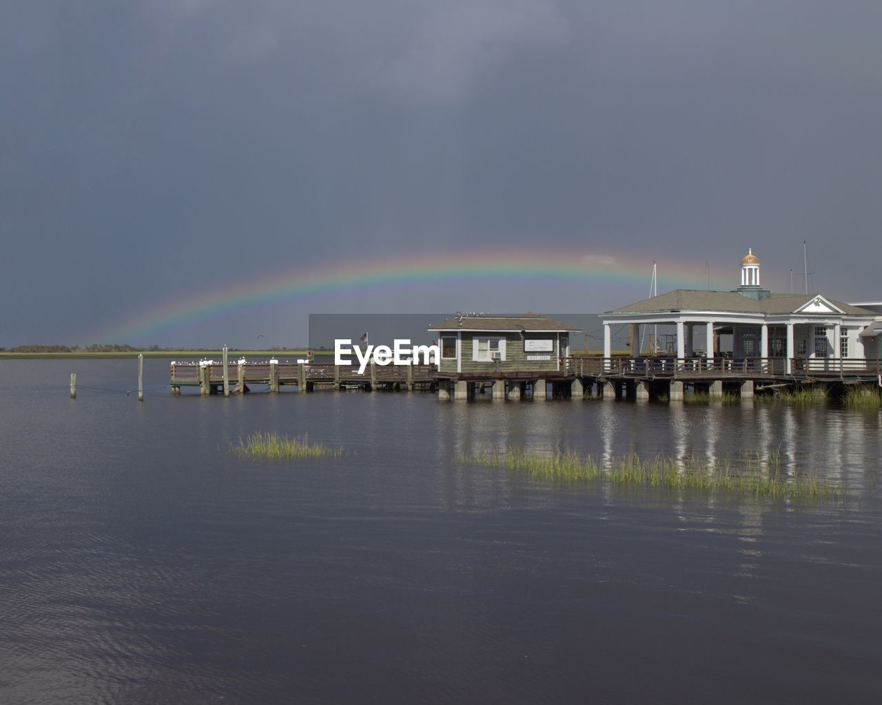 VIEW OF RAINBOW OVER SEA AGAINST SKY