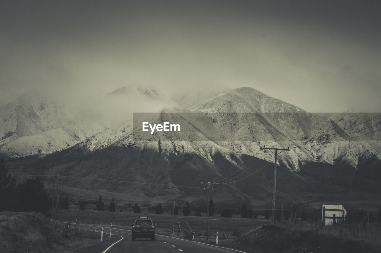 SCENIC VIEW OF MOUNTAIN RANGE AGAINST SKY