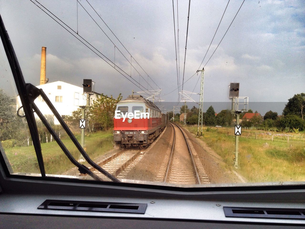 Train seen through windshield