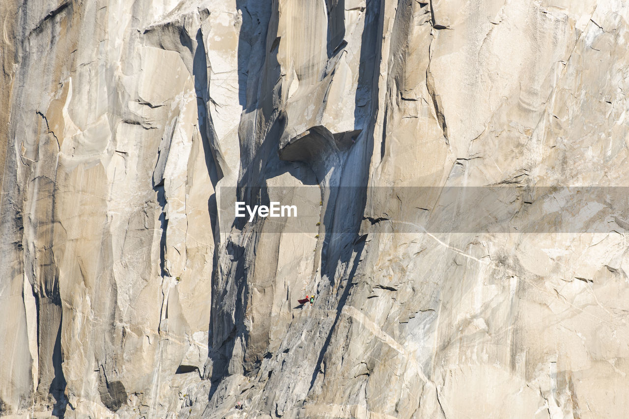 Athlete climbing the great roof on the nose, el capitan, at sunrise