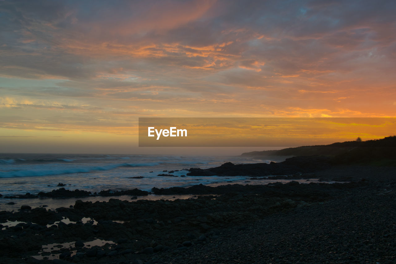 Scenic view of sea against sky during sunset
