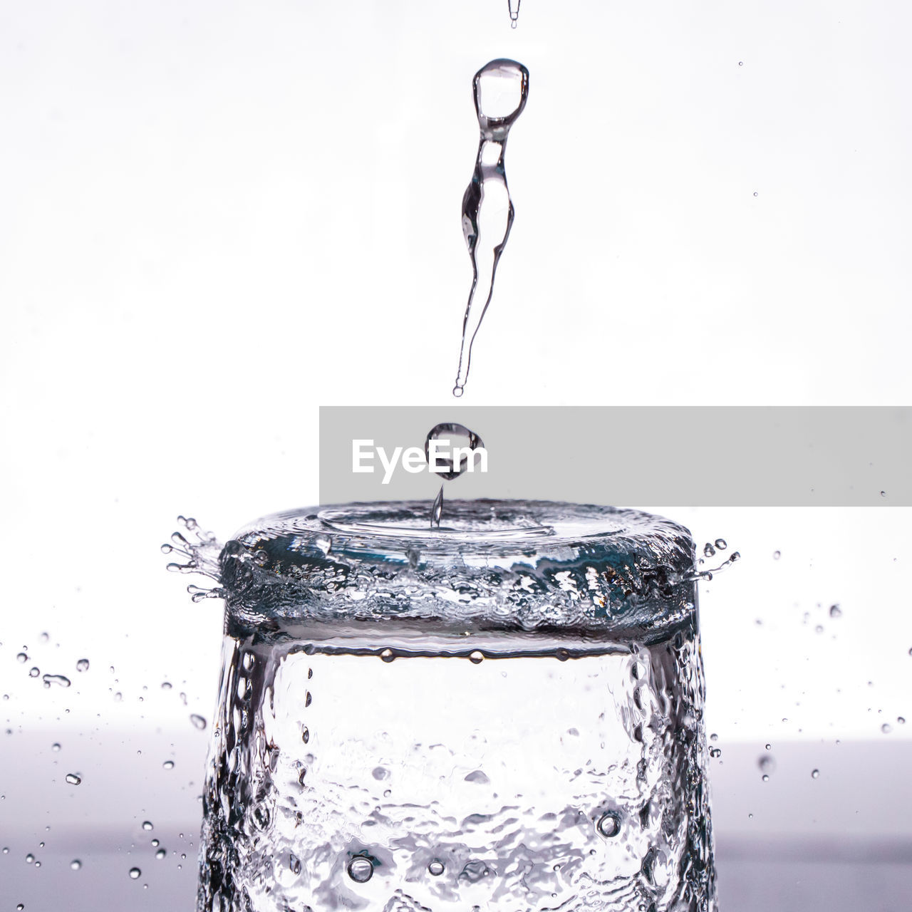 Close-up of water drop against white background