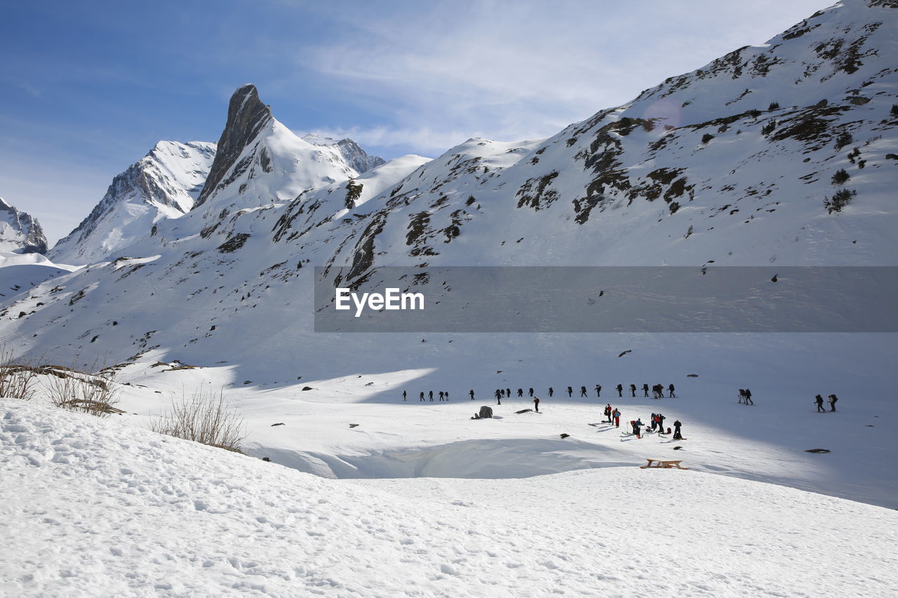 Scenic view of snowcapped mountains against sky