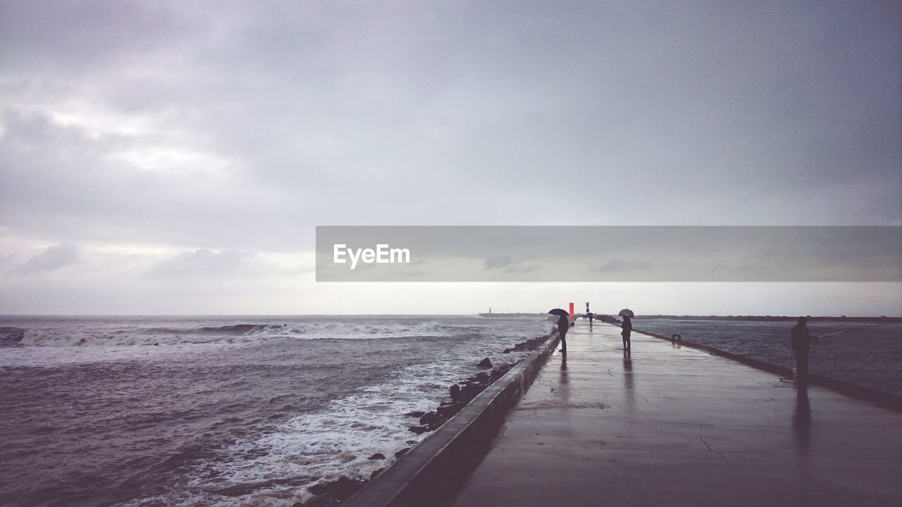 Scenic view of sea against cloudy sky during monsoon