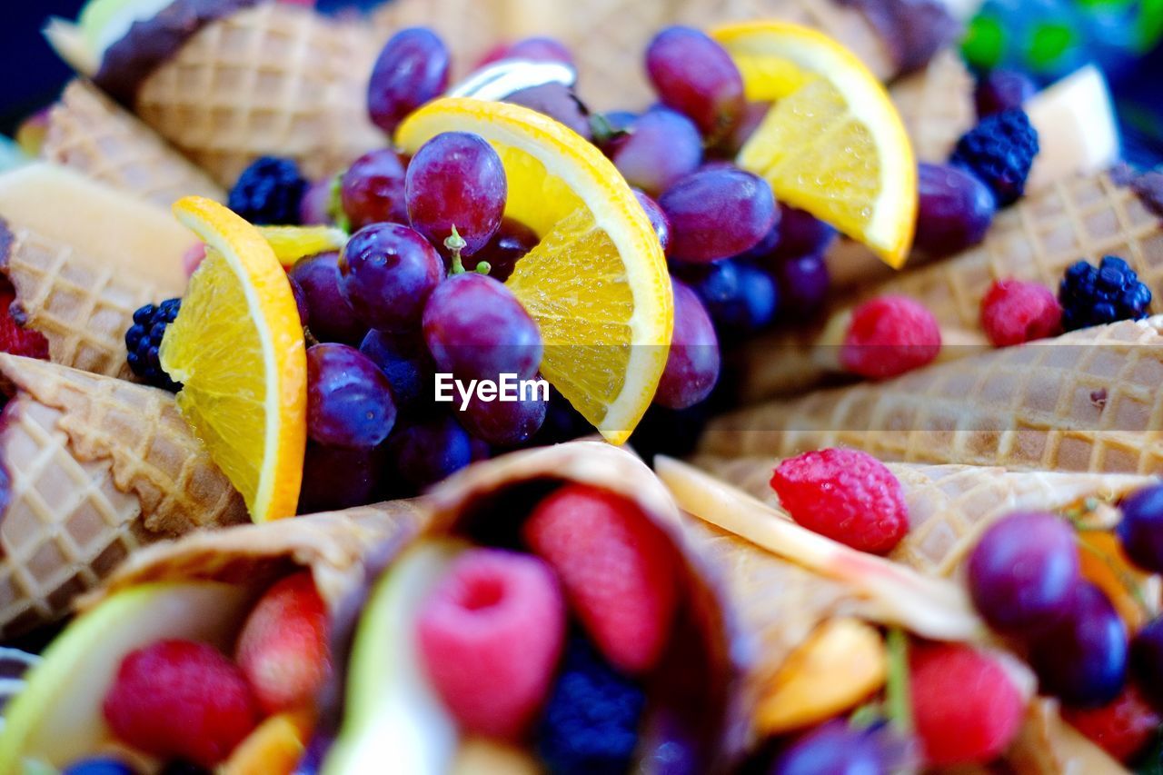 Full frame shot of various fruits in ice cream cone