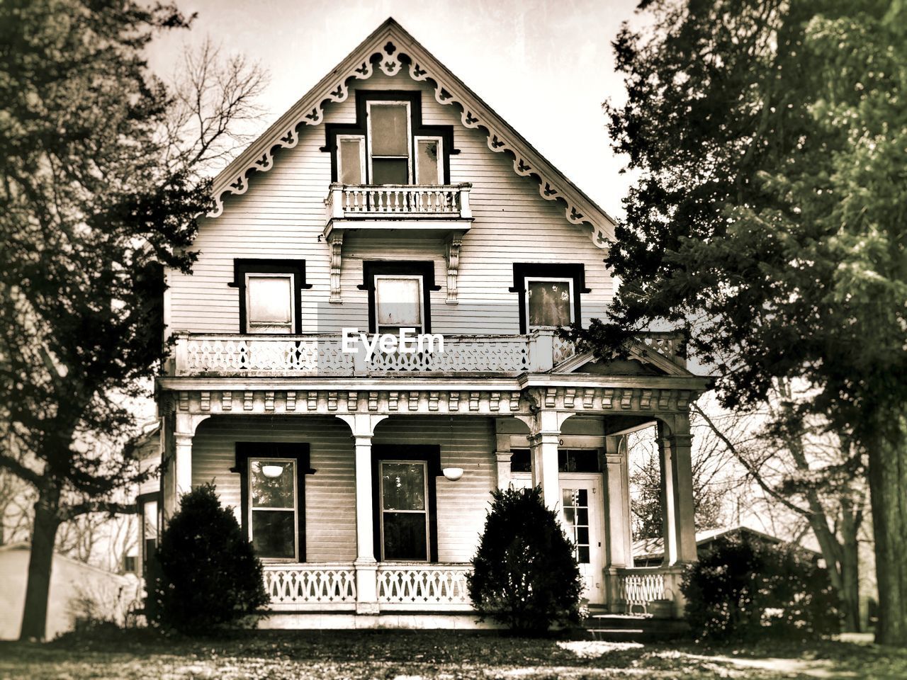 View of house with trees in background