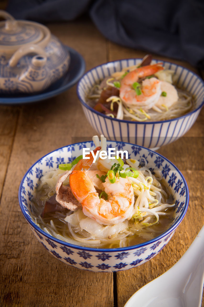 High angle view of shrimp soup in bowl on table