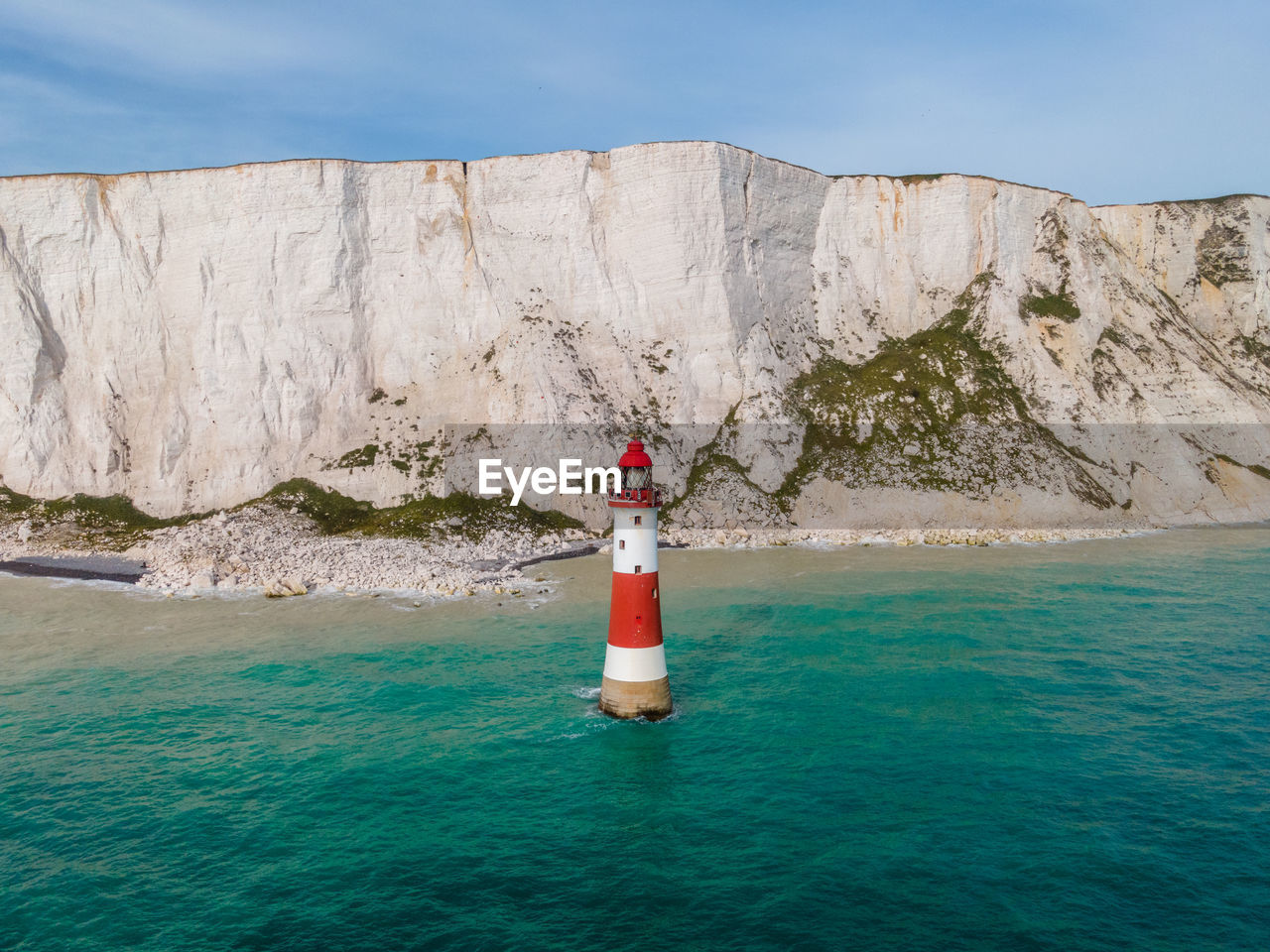 Beachy head lighthouse and the cliffs of the seven sisters in england.