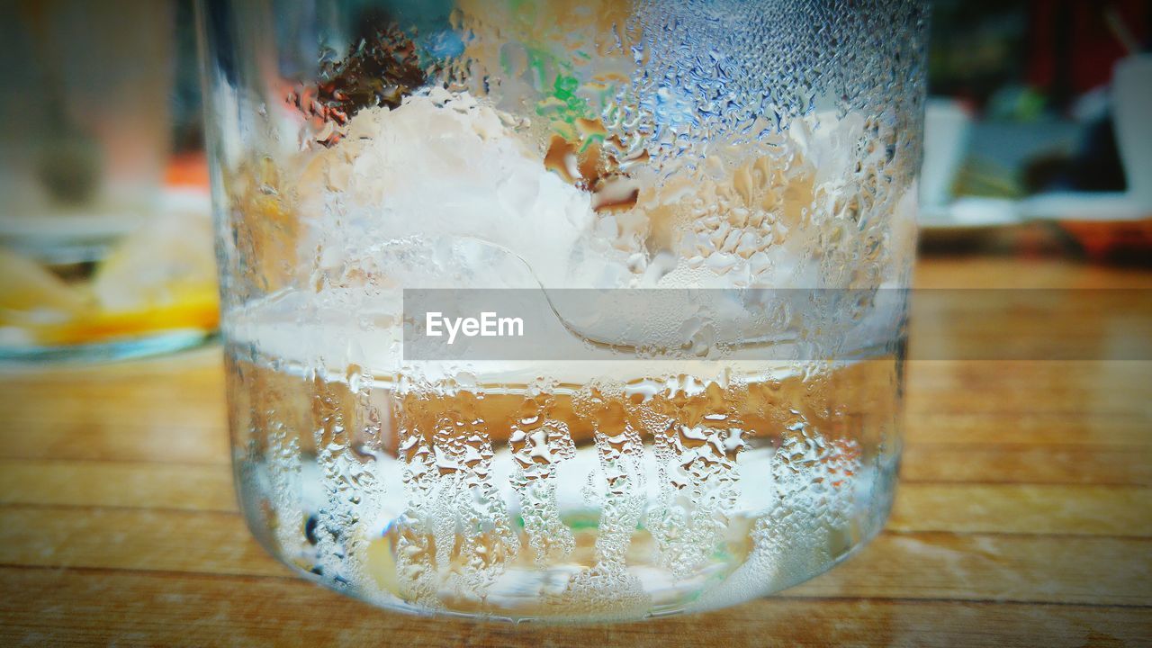 CLOSE-UP OF DRINK ON TABLE